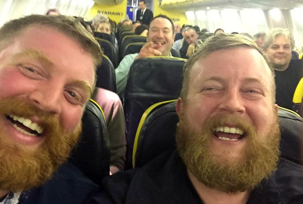 Photo issued by Neil Thomas Douglas of two strangers who found themselves sitting next to each other on a flight.