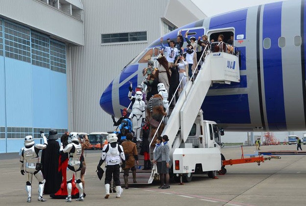 Passengers and Stormtroopers on Star Wars-themed flights ear in Toyko last month. 