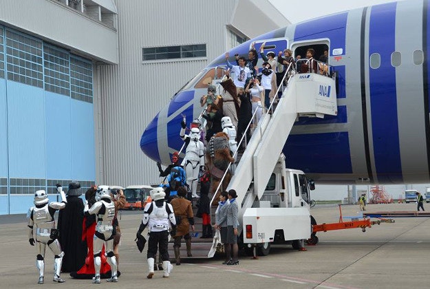 Passengers and Stormtroopers on Star Wars-themed flights ear in Toyko last month.