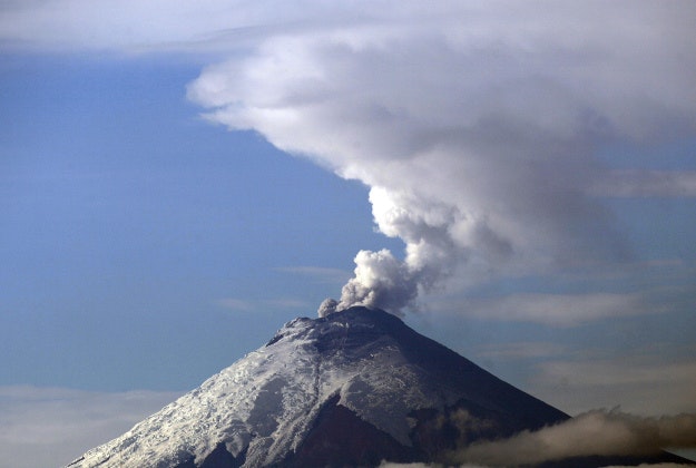 The Cotopaxi volcano spews ash and vapor, as seen from Quito, Ecuador. Cotopaxi began showing renewed activity in April and its last major eruption was in 1877.