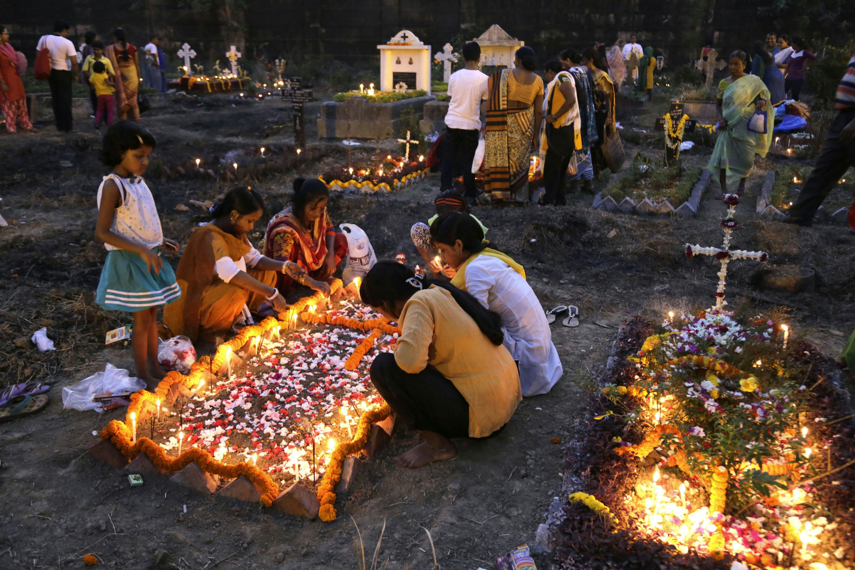 Indian Christians pay tribute at the graves of their dear ones on All Souls Day.