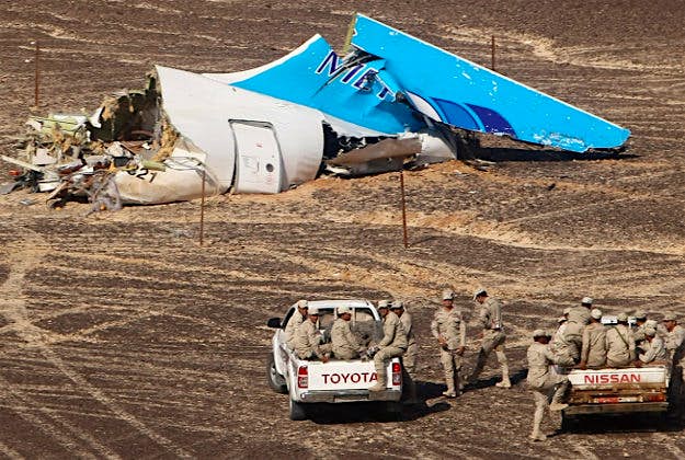 Travel News - egypt plane 1 Egyptian Military on cars approach a plane's tail at the wreckage of a passenger jet bound for St. Petersburg in Russia that crashed in Hassana, Egypt, on Sunday, Nov. 1, 2015.