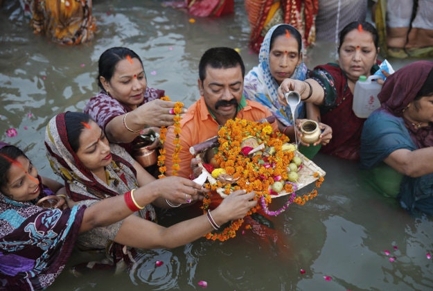 Hindu devotees perform religious rituals in the River Ganges to mark Chhath Puja festival in Allahabad, India, Wednesday, Nov. 18, 2015. During Chhath, an ancient Hindu festival, rituals are performed to thank the Sun god for sustaining life on earth.