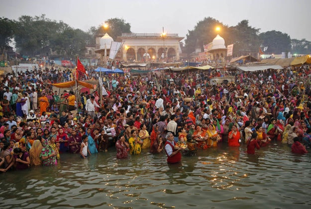 Hindu devotees offer prayers standing in the waters of the River Ganges to mark Chhath Puja festival in Allahabad, India, Wednesday, Nov. 18, 2015. During Chhath, an ancient Hindu festival, rituals are performed to thank the Sun god for sustaining life on earth.