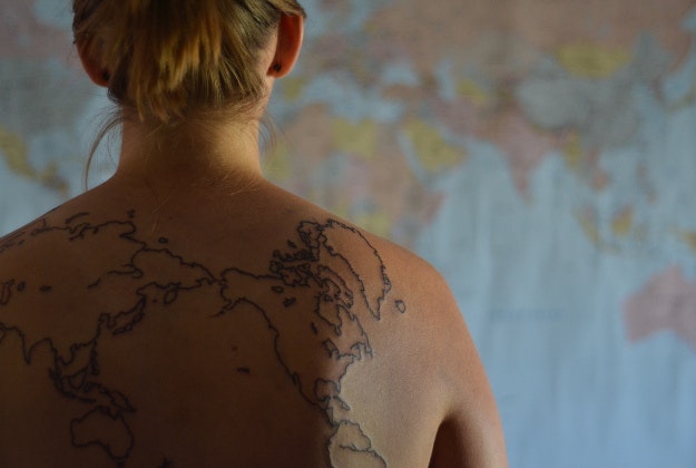One way of finding your way: a tattoo of the world on your back.