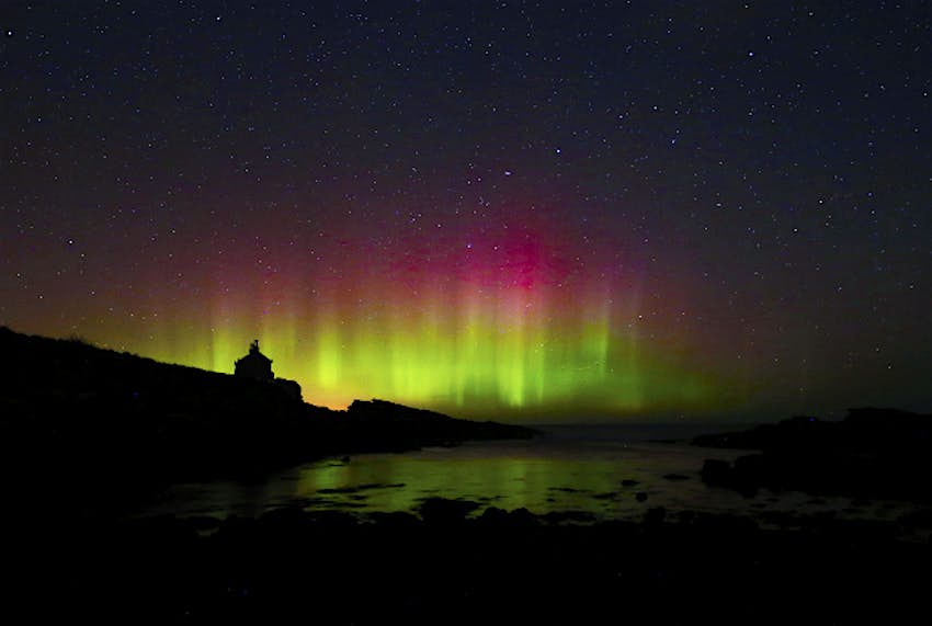 Travel News - photo6 The Northern Lights, or Aurora Borealis, shine over the Bathing House in Howick, Northumberland.