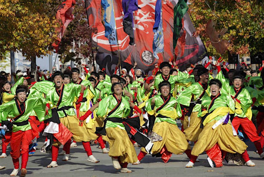 Travel News - photos14 Participants perform as they parade through Tokyo streets during an annual Yosakoi festival in Tokyo, Sunday, Nov. 1, 2015. Yosakoi is a unique and modern rendition of the popular traditional Japanese dance of Awa Odori and many troupes compete with their choreographed dance in colorful costumes, performed often with the Japanese instrument of Naruko, a clapper held in both hands.