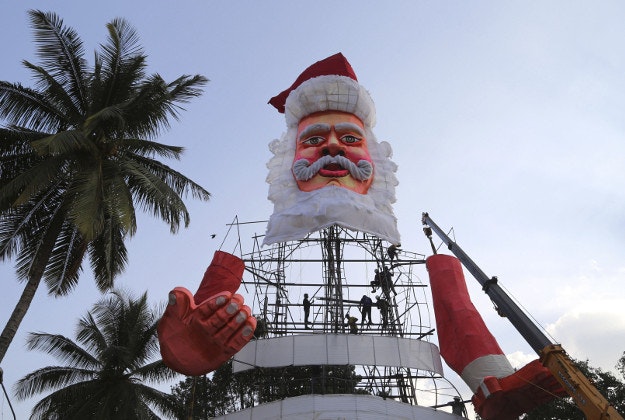 Indian workers make a larger than life size statue of Santa Claus in the premises of St. Joseph's Church ahead of Christmas celebrations in Bangalore, India, Tuesday, Dec. 15, 2015. Though Hindus and Muslims comprise the majority of the population in India, Christmas is celebrated with much fanfare. 