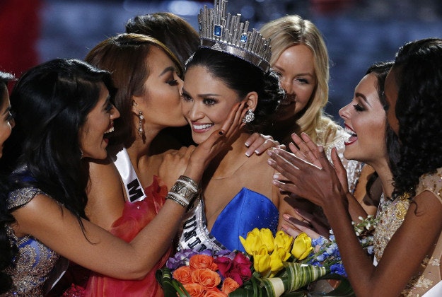 Other contestants congratulate Miss Philippines Pia Alonzo Wurtzbach after she was crowned Miss Universe at the Miss Universe pageant Sunday, Dec. 20, 2015, in Las Vegas. According to the pageant, a misreading led the announcer to read Miss Colombia Ariadna Gutierrez as the winner before they took it away and gave it to Miss Philippines. 