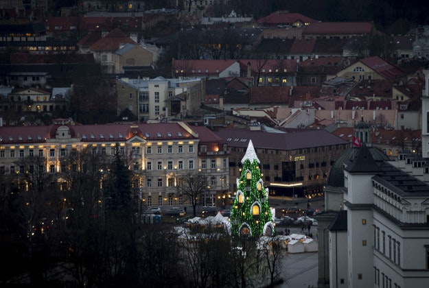 The national Christmas tree stands in Cathedral Square in Vilnius, Lithuania, Wednesday, Dec. 23, 2015.