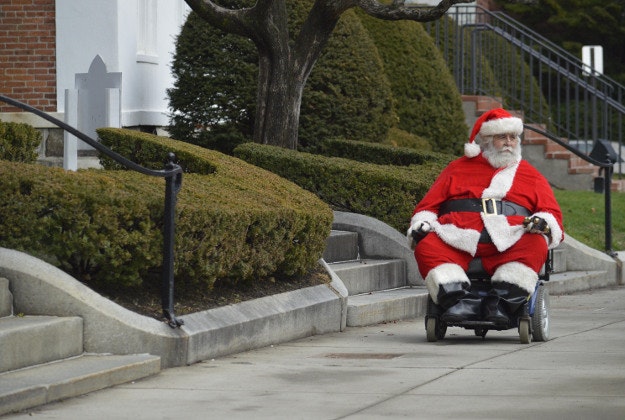 Ken Keefner, dressed as Santa, rides his wheelchair on Park Square in Pittsfield, Mass., Wednesday, Dec. 23, 2015. Record warmth was expected on Christmas Eve along the East Coast, said Bob Oravec, lead forecaster with the National Weather Service.