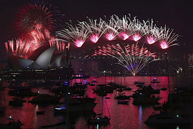 Travel News - New year 2015 4 Fireworks explode over the Opera House and Harbour Bridge during New Year's Eve fireworks display in Sydney.