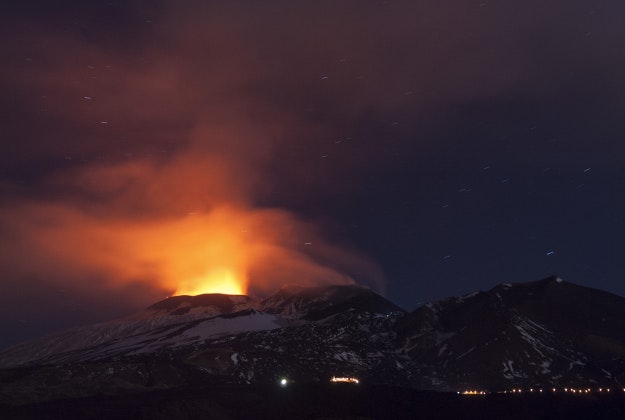In this picture made available Friday, Dec. 4, 2015, Mt. Etna spews lava during an eruption, near Catania, Italy, Thursday Dec. 3, 2015. Mt. Etna is Europe's most active volcano at 3,350 meters (10,990 feet) and erupts quite frequently.