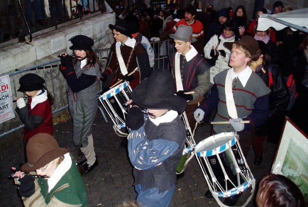 People celebrate l'Escalade in Geneva, Switzerland. 