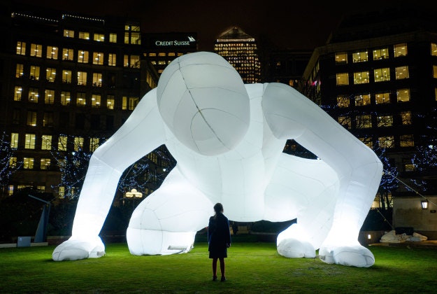 Ava, 8, from Tower Hamlets looks at Fantastic Planet by Amanda Parer as it illuminates Westferry Garden in Canary Wharf, London, as part of the Winter Lights Festival 2016, which opens free to the public today and runs until 22nd January. 
