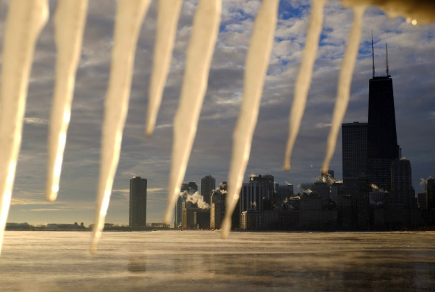 Icicles hang over a rail along the shore of Lake Michigan, Wednesday, Jan. 13, 2016, in Chicago. Bitter cold temperatures early Wednesday greeted commuters in the Chicago area. 