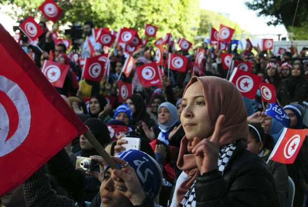 Tunisians celebrate the fifth anniversary of the Arab Spring, Thursday, Jan.14, 2016 in Tunis. Tunisian teachers, activists and political parties have joined to celebrate five years since protesters drove out their autocratic president and ushered in a democratic era. 