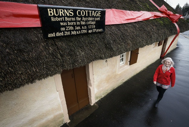 Events Manager Claire Grant walks past the bow on Burns Cottage in Alloway, Scotland, where Scottish poet Robert Burns was born, ahead of the Burns Night celebrations. Robert Burns Birthplace Museum comprises of the famous Burns Cottage where the poet was born and a modern museum housing the world's most important collection of his life and works. Burns Night takes place on the birthday of the Scottish poet who was born on 25 January 1759 in the village of Alloway. 