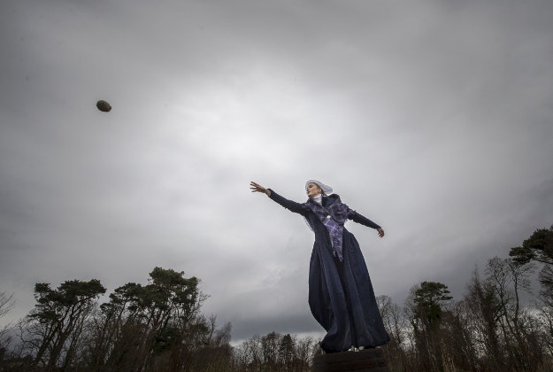Rebekah McGinn, dressed in a late 18th century costume, takes part in the 1759 World Haggis Hurling Championship 2015 at Burns Cottage in Alloway, Scotland, where Scottish poet Robert Burns was born, ahead of the Burns Night celebrations. 