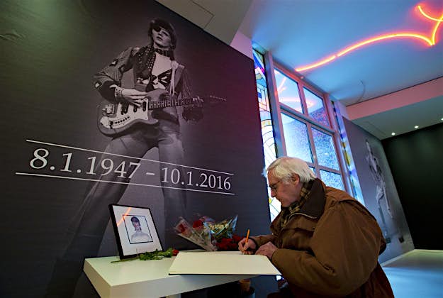 Travel News - 5 A man signs a book of condolences for deceased popstar David Bowie at the Groninger Museum which hosts the "DAVID BOWIE is' exhibit, in Groningen, northern Netherlands, Monday, Jan. 11, 2016. The museum is normally closed on Mondays but opened its doors to allow people to sign a condolence register and visit the Bowie exhibit which runs till March 13, 2016.