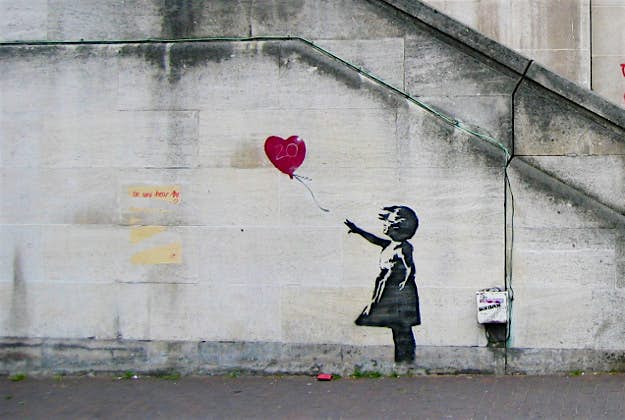 Travel News - Banksy One of Banksy's iconic pieces of street art.