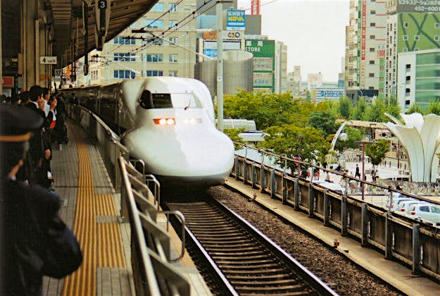 Travel News - Bullet train Customers wait to embark Japan's bullet train.