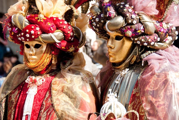 Masked revellers celebrate Venice's Carnevale.