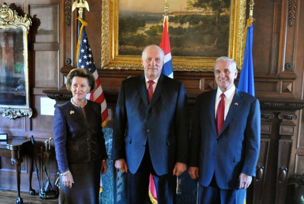 The King (centre) and Queen of Norway with Governor Dayton.