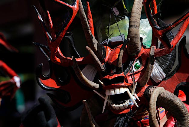 Travel News - ecuador Man dressed in a diablo mask in Ecaudor