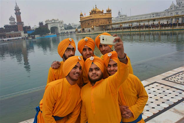 Travel News - sikh guru Sikh devotees take a selfie in Amritsar, India