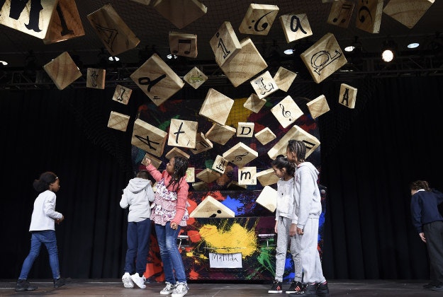 Children explore the 'Crunchem Catchem Spellem' giant satchel installation designed by set designer Rob Howell and based on Matilda the Musical, during the launch of the Southbank Centre's annual Imagine Children's Festival at the Southbank Centre, London, which will celebrate Roald DahlÕs centenary, with a range of Roald Dahl themed events and installations. PRESS ASSOCIATION Photo. 