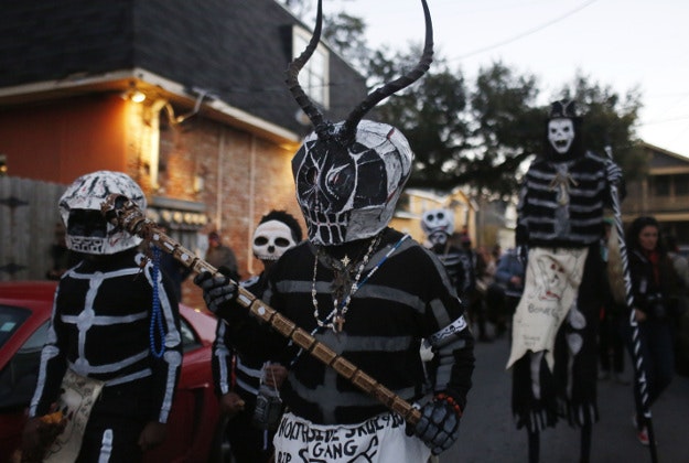 The North Side Skull & Bone Gang parade down the streets during the wake up call for Mardi Gras, Tuesday, Feb. 9, 2016, in New Orleans. Their costumes are intended to represent the dead and they bring a serious message, reminding people of their mortality and the need to live a productive and good life. 