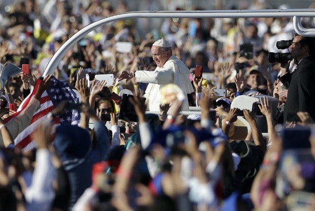 Pope Francis looks at his watch as he arrives for an outdoor Mass in Ciudad Juarez, Mexico, Wednesday, Feb. 17, 2016. Pope Francis is scheduled to wrap up his trip to Mexico on Wednesday with some of his most anticipated events: a visit in a Ciudad Juarez prison just days after a riot in another lockup killed 49 inmates and a stop at the Texas border when immigration is a hot issue for the U.S. presidential campaign.