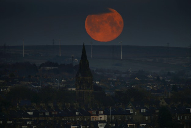 A full moon sets over Bradford, West Yorkshire. 