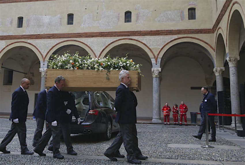 Travel News - 11247061-1 The coffin of Italian writer Umberto Eco is shoulder carried inside the Castello Sforzesco fortress on the occasion of his funeral service in Milan, Italy, Tuesday, Feb. 23, 2016. Eco, best known for the international best-seller, The Name of the Rose, died Friday, Feb. 19, 2016. He was 84.