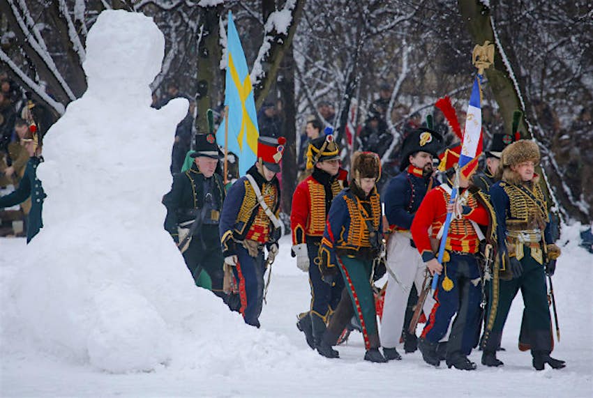 Travel News - 11247071-1 Members of an historic club wearing 1812-era French army uniforms march during an historic festival to mark Defenders of the Fatherland Day in St.Petersburg, Russia, Tuesday, Feb. 23, 2016. The day, honors the nation's military and is a nationwide holiday.