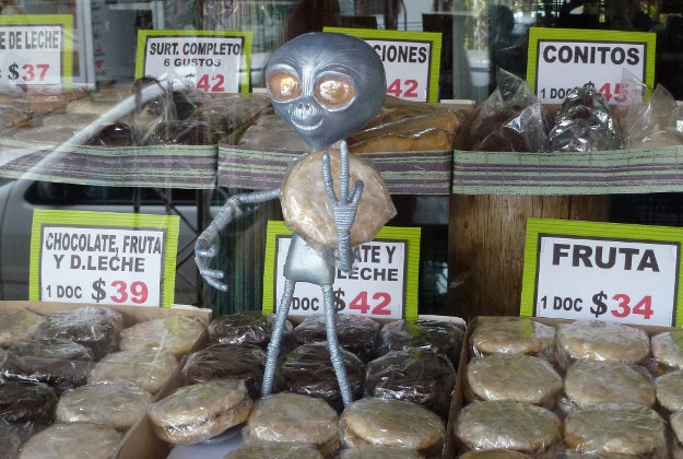 Alien offering alfajores for sale in Capilla del Monte, Argentina. 
