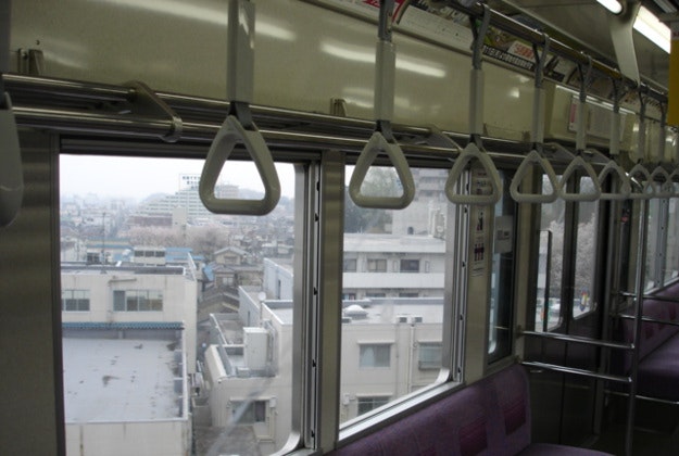 Inside a Tokyo train carriage.