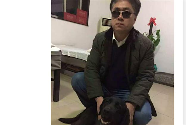 Travel News - dog Tian Fengbo and his dog QiaoQiao