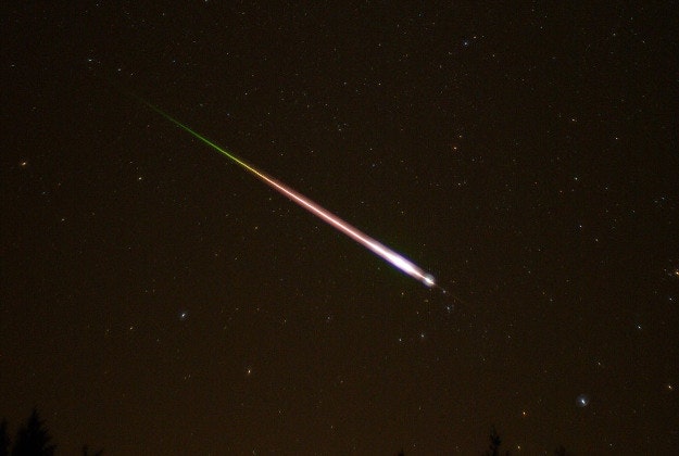 A meteor sailing through the night sky.