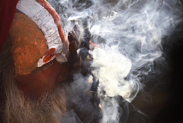 Travel News - 11364351-1 A Hindu holy man smokes marijuana at the courtyard of the Pashupatinath temple during "Shivaratri" festival in Kathmandu, Nepal, Monday, March 7, 2016. "Shivaratri," or the night of Shiva, is dedicated to the worship of Lord Shiva, the Hindu god of death and destruction.
