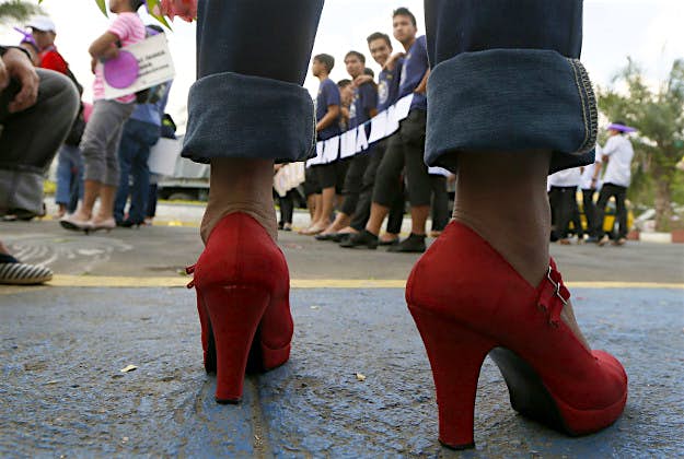 Travel News - 11364666-1 Male students and soldiers wearing high-heeled shoes march around a park to pay tribute to women all over the world on the eve of the celebration of International Women's Day Monday, March 7, 2016 at suburban Quezon city, northeast of Manila, Philippines. The all male marchers are calling for gender equality and an end to all forms of discrimination and harassment against women.