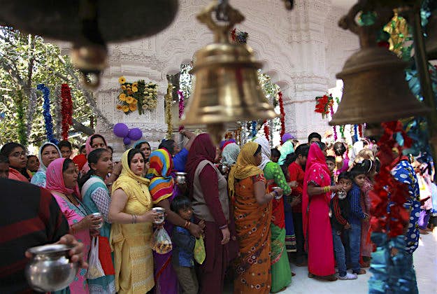 Travel News - 11364786-1 Indian Hindu women devotees carry pots of sacred water and milk as they stand in queue to offer prayers at a temple on the occasion of the Mahashivratri festival in Jammu, India, Monday, March 7, 2016. Hindus across the world are celebrating Mahashivratri, or Shiva's night festival believed to be the day when Shiva got married.
