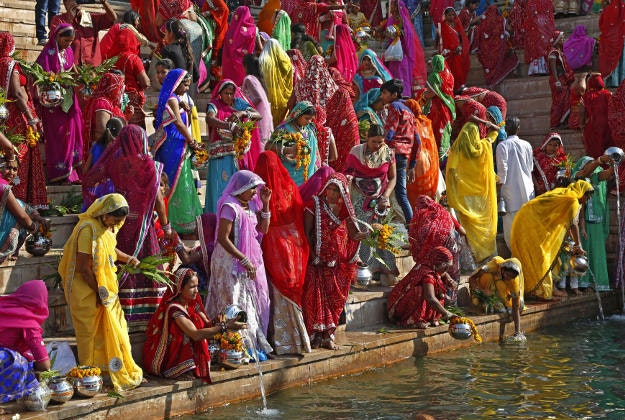 Hindu women collect water from the Pushkar lake to pour on idols of Lord Shiva, on occasion of Mahashivratri festival in Pushkar, India, Monday, March 7, 2016. Hindus across the world are celebrating Mahashivratri, or Shiva's night festival believed to be the day when Shiva got married. 