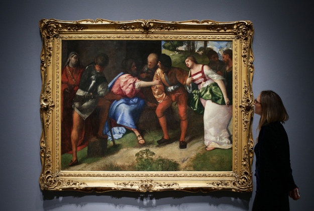 A member of staff looking at Titian's Christ and the Adulteress which is on display as part of the In the Age of Giorgione exhibition, at the Royal Academy of Arts, London. 