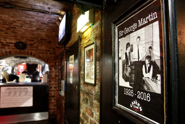 Tributes to the record producer known as the Fifth Beatle, Sir George Martin, are placed at The Cavern, Liverpool following his death aged 90. Sir George helped The Beatles achieve global success while head of the Parlophone record label after hearing their demo tape in 1962. His family confirmed he died peacefully at his home as tributes poured in from the world of music and beyond.