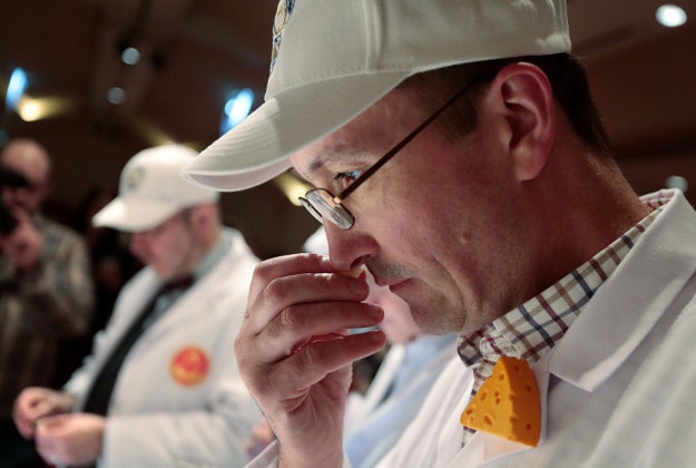 Adrian Fowler, a cheese judge from the United Kingdom associated with the Society of Dairy Technology and the British Specialist Cheesemakers Association, smells a sample of Roth Grand Cru Surchoix by Emmi Roth USA during the final round of judging at the 2016 World Championship Cheese Contest at Monona Terrace Community and Convention Center in Madison, Wis., Wednesday, March 9, 2016. The cheese, later named world champion, was made in Monroe, Wis., and is the first American-made cheese to win the top prize since 1988. 