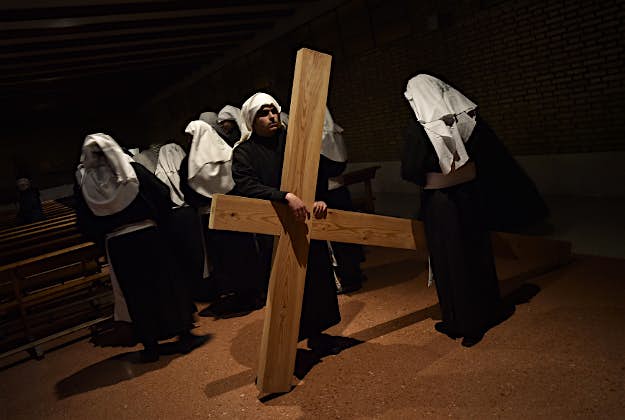 Travel News - 11526946-1 Penitents take part in the procession of the "Santa Veracruz" brotherhood, during Holy Week in Calahorra, northern Spain, Wednesday, March 24, 2016. Hundreds of processions take place throughout Spain during the Easter Holy Week.
