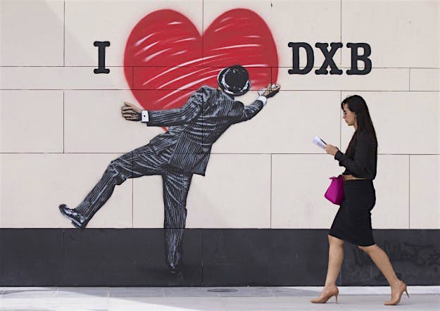 Travel News - Dubai Walls Street Art A woman walking past a piece by British stencil artist Nick Walker, at the launch of Dubai Walls at City Walk, Dubai - the first large-scale collection of street art in the Middle East, featuring 14 of the world’s top street artists representing five continents.