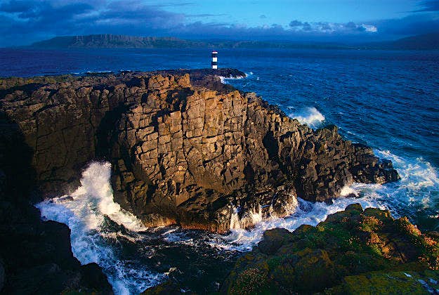 Travel News - 20151_Rathlin_Island Rathlin Island is an island off the coast of County Antrim in Northern Ireland, and is the northernmost point of the region. Six miles from the mainland, Rathlin is the only inhabited offshore island in Northern Ireland, and is the most northerly inhabited island off the Irish coast. The L-shaped island is only 15 miles from the Mull of Kintyre and is one of Northern Ireland's Special Areas of Conservation due to it's large bird's colony.